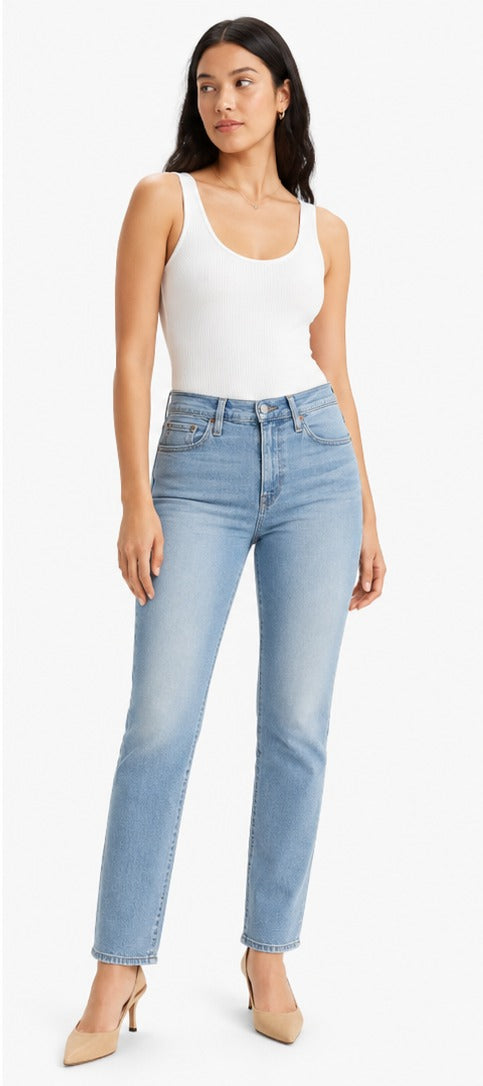 Model wearing Levi's 314 Shaping Straight light blue wash – women's mid rise tummy slimming straight leg denim size 28