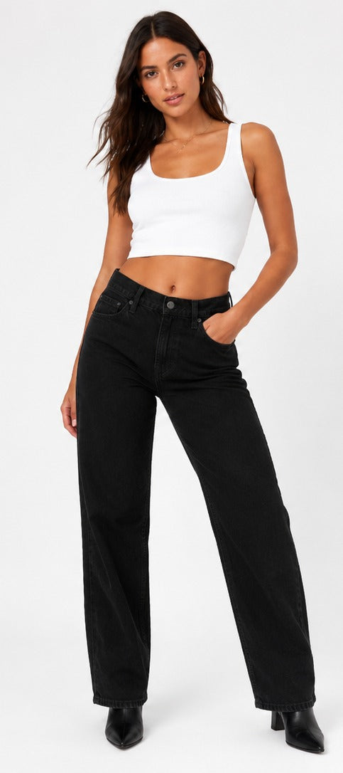 Model wearing Levi's '94 Baggy black wash – women's mid rise loose straight leg denim size 28