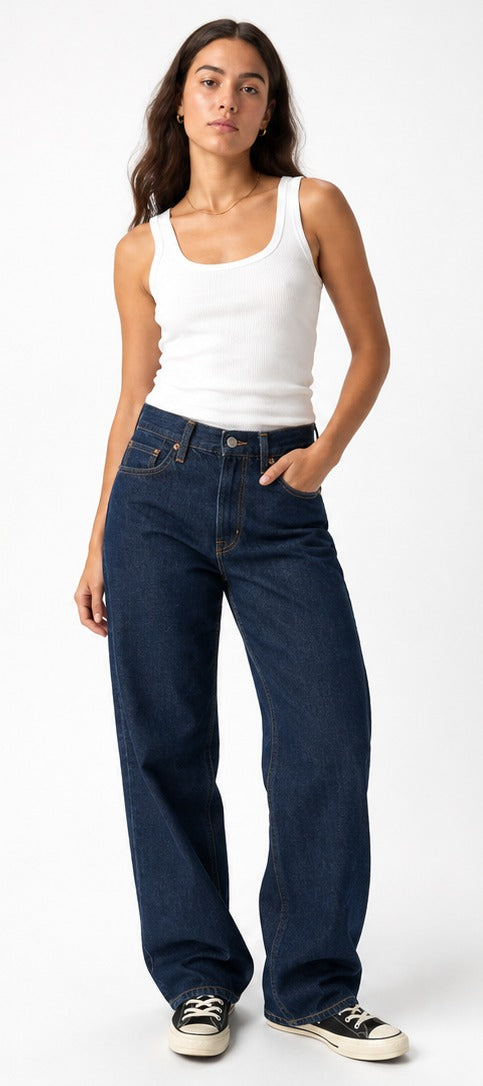Model wearing Levi's '94 Baggy dark navy wash – women's mid rise loose straight leg denim size 28