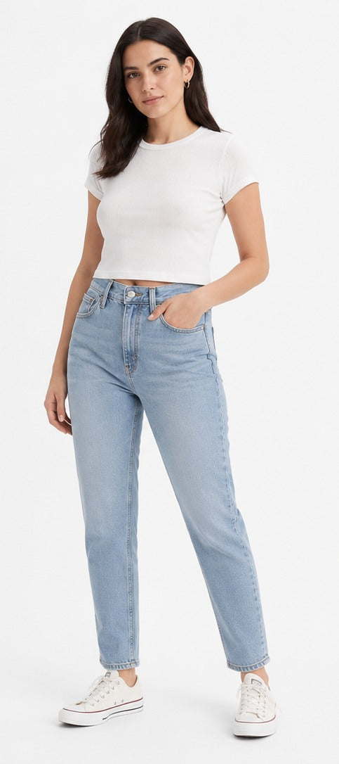 Model wearing Levi's '80s Mom Jean light blue wash – women's high rise tapered leg denim size 28